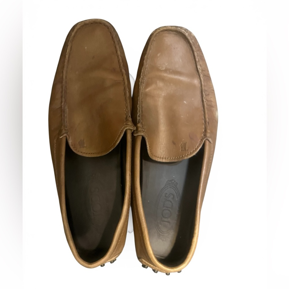 Elegant brown leather driving loafers by Tod's.